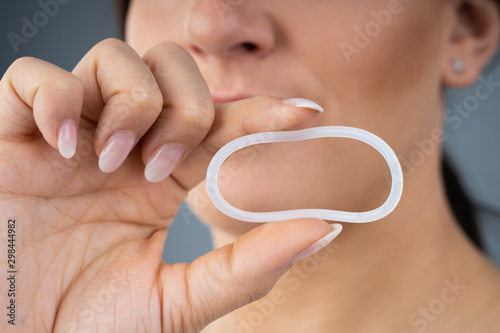 Woman Holding Vaginal Ring photo