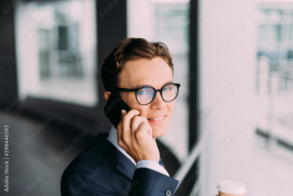 Cheerful employee talking on phone stock photo Cheerful employee talking on phone stock photo