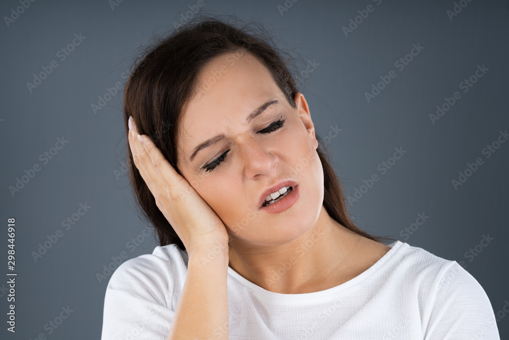 Woman Suffering From Sore Ear Woman Suffering From Sore Ear