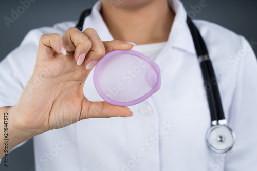 Doctor Holding Diaphragm