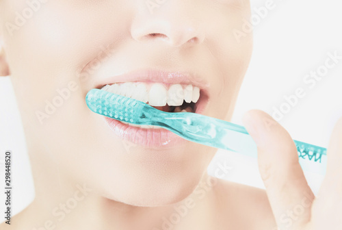 Healthy woman teeth and smile. Isolated over white background. Dental clinic.