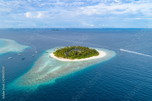 Aerial view of beautiful island at Maldives in the Indian Ocean. Top view from drone.