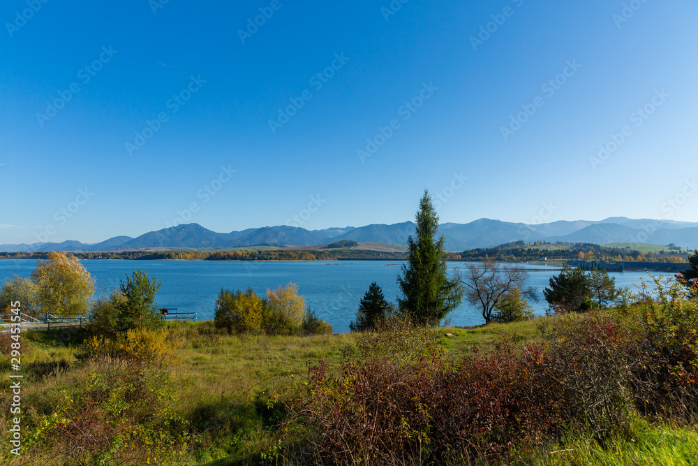 Obraz premium Beautiful nature autumn landscape with colorful forest and lake.Country Slovakia