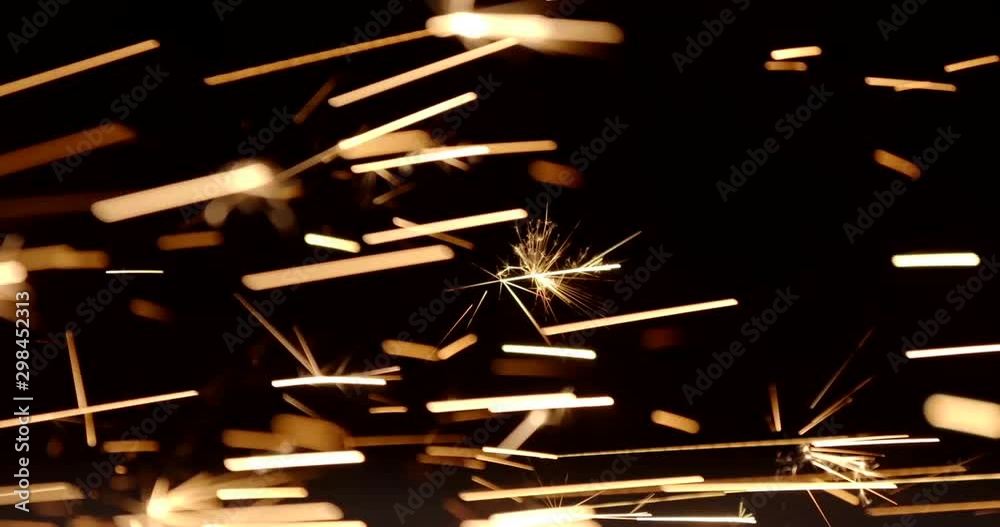 Male hand cuts off pieces of water pipe with angle grinder. Cutting of a steel with splashes of sparks at construction site. Sparks during cutting of metal angle grinder