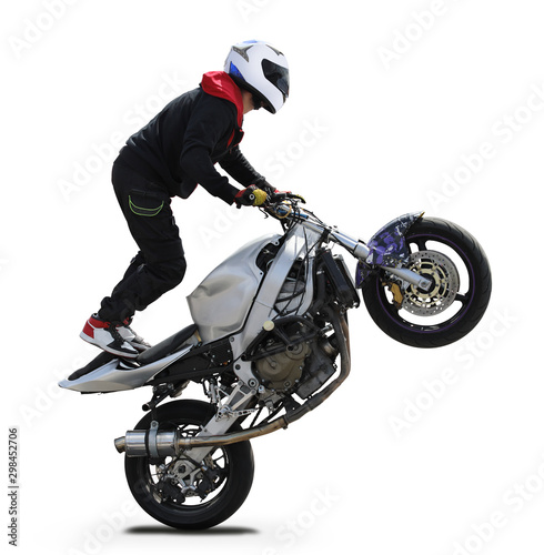A motorcyclist performs a stunt on a sports motorcycle