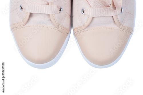 Women's pink canvas sneakers with beads close-up toe on a white background