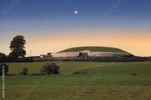 The Newgrange Megalithic Passage Tomb at dusk photo