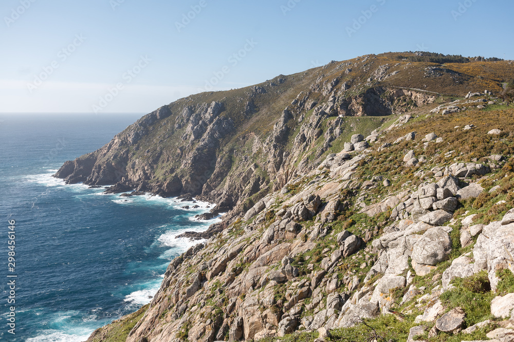 Beautiful landscape scenery of Cape Finisterre. Mountain ocean shore in Spain Beautiful landscape scenery of Cape Finisterre. Mountain ocean shore in Spain