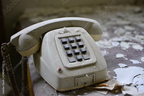 old telephone on a black background photo