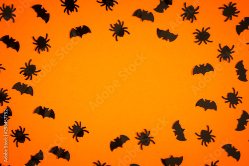 Flat lay halloween composition on orange background.