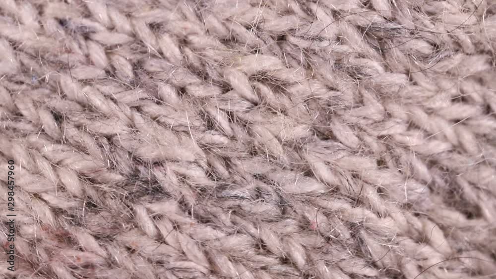piece of knitted fabric rotates slowly. background piece of knitted fabric rotates slowly. background