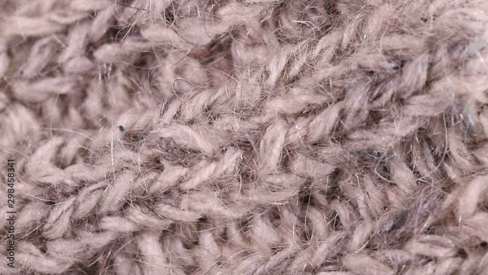 piece of knitted fabric rotates slowly. background