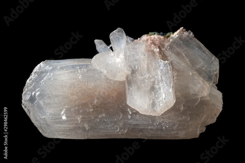 Stilbite mineral crystal cluster from India isolated on a pure black background photo