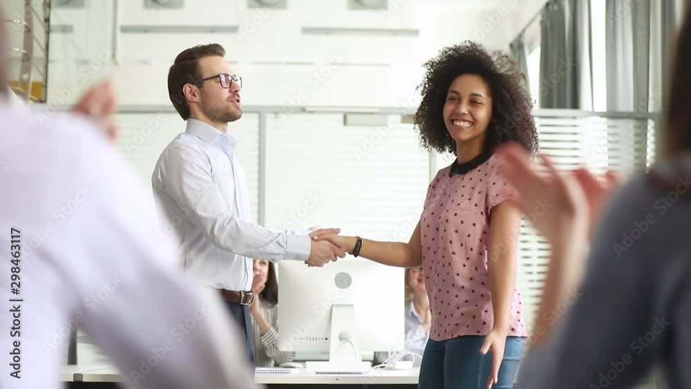 Staff cheering employee of month boss shaking hands express gratitude ...