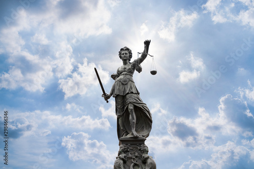 Justilia, Lady Justice or Themis and blue sky