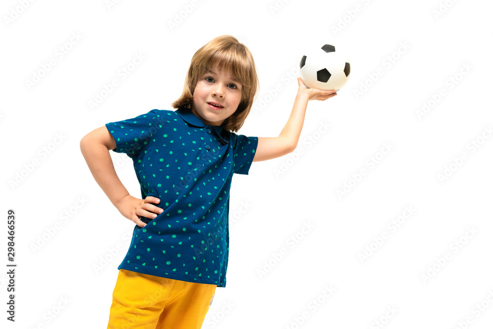 Picture of a teenage caucasian boy holds a soccer ball in one hand isolated on white background Picture of a teenage caucasian boy holds a soccer ball in one hand isolated on white background