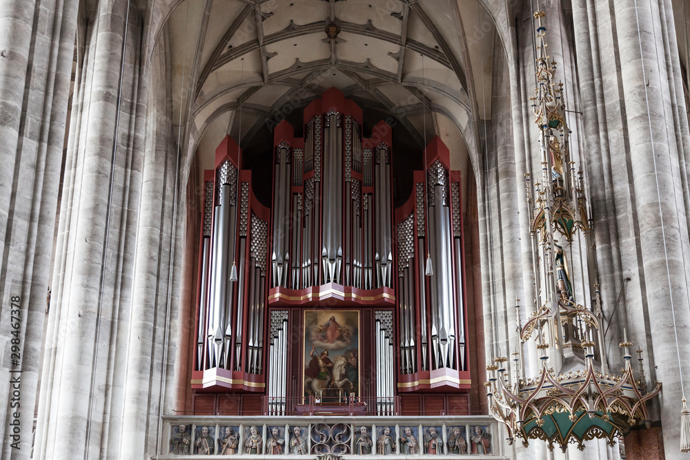The interior of the Church of St. George in Dinkelsbuhl, ancient musical organ. Bavaria. Germany