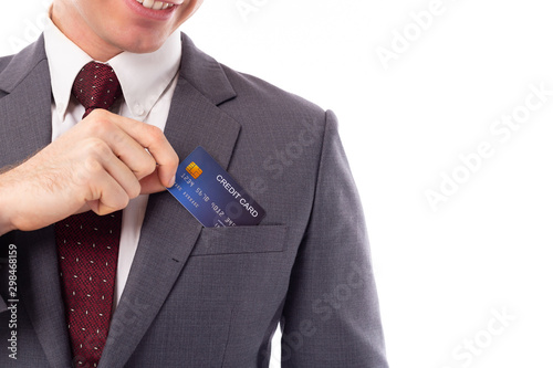 Bild auf Leinwand Businessman pick credit card from suit pocket for paying, buying, shopping product with smiley face, happiness