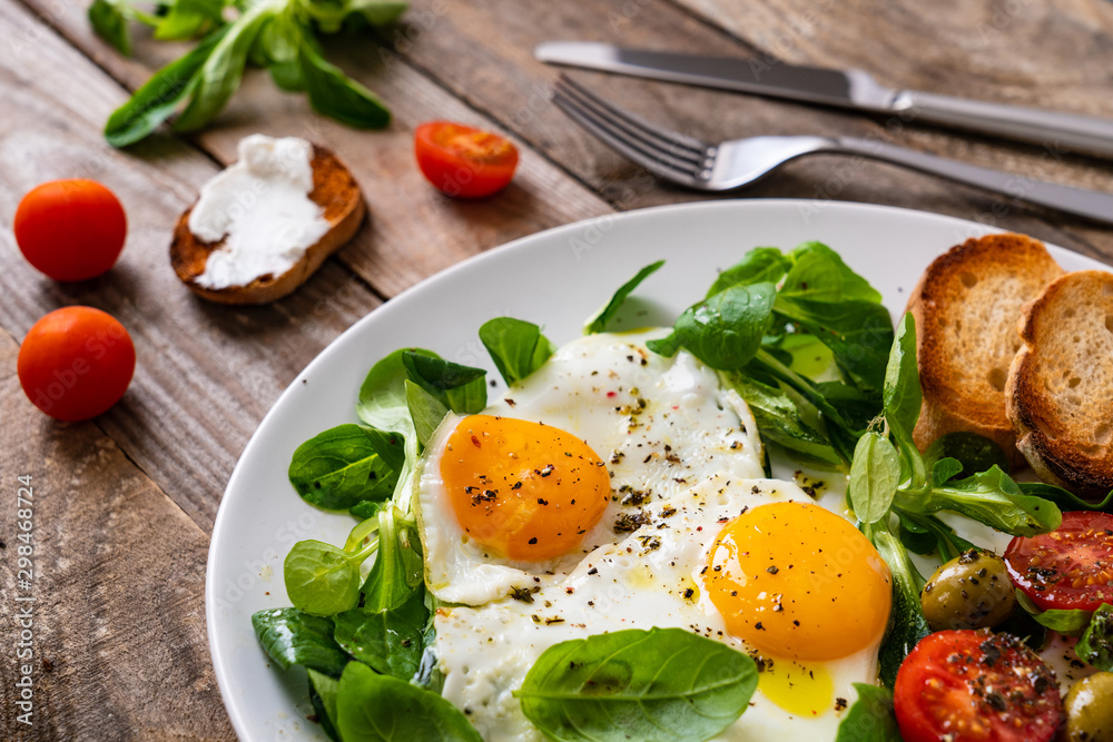 Breakfast - fried egg ,toasts and vegetabla salad