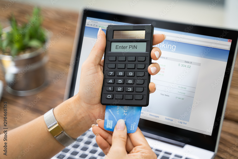 Woman Using Two Factor Authenticating For Bank Transfer Woman Using Two Factor Authenticating For Bank Transfer