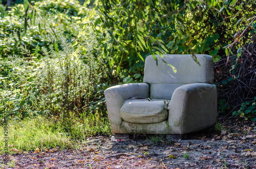 Novi Sad, Serbia - September 29. 2019: Sandy beach on the Danube River. Discarded armchair on the shores of the Danube River.