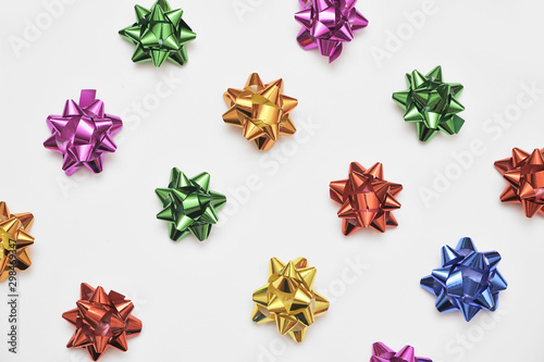 Festive colorful bows on white background. Holiday background. Christmas concept.