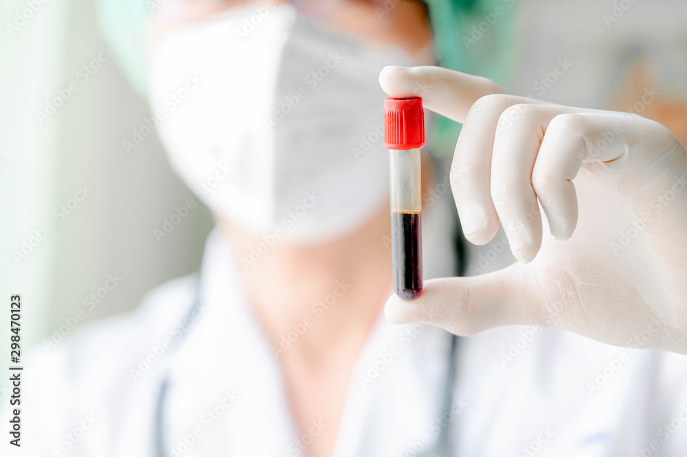Close up of doctor hand holding blood sample. Copy space. Close up of doctor hand holding blood sample. Copy space.