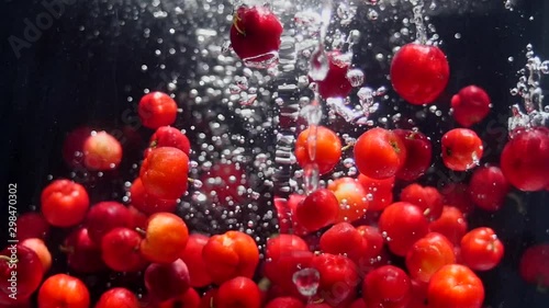 Falling Red Berries Slow Motion. Fruits. Healthy Food. Organic photo