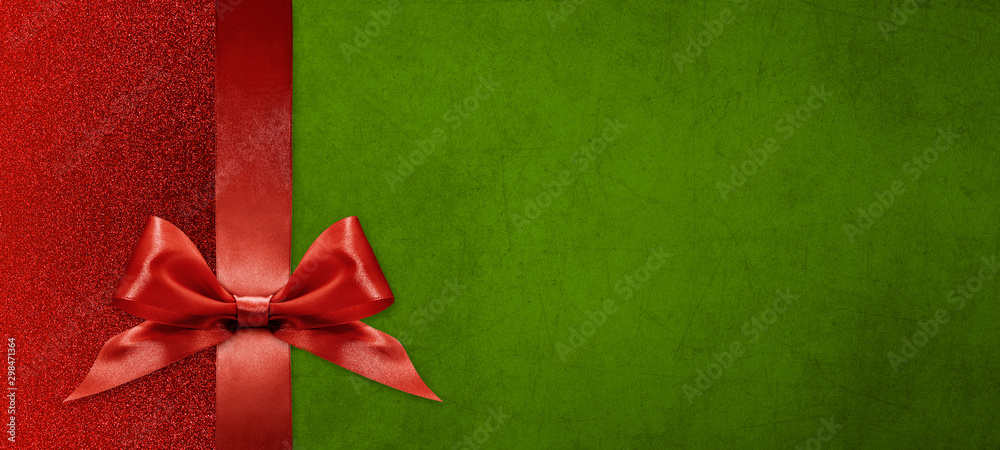 gift card wishes merry christmas background with red ribbon bow on green shiny vibrant color texture template with blank copy space
