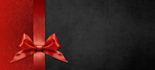 gift card wishes merry christmas background with red ribbon bow on black shiny vibrant color texture template with blank copy space