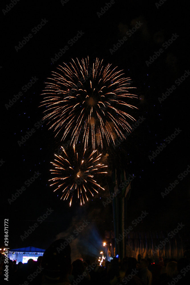 Crowd watching fireworks and celebrating, beautiful fireworks light up the sky, New Year celebration fireworks Crowd watching fireworks and celebrating, beautiful fireworks light up the sky, New Year celebration fireworks
