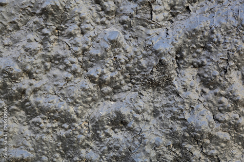 Black textured surface of volcanic lava as an element of design and decoration