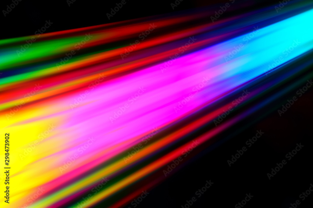 Colourfull burst of prismatic light creating lines of blured motion against a black background