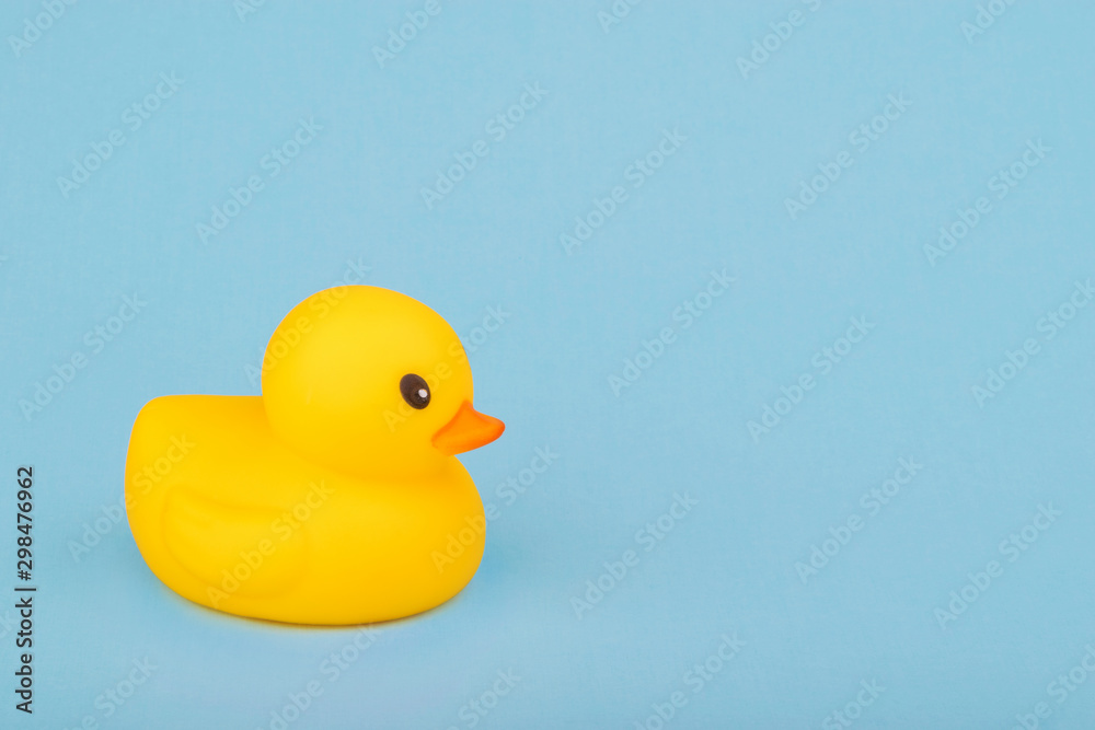 Fototapeta premium bath yellow rubber duck on blue background