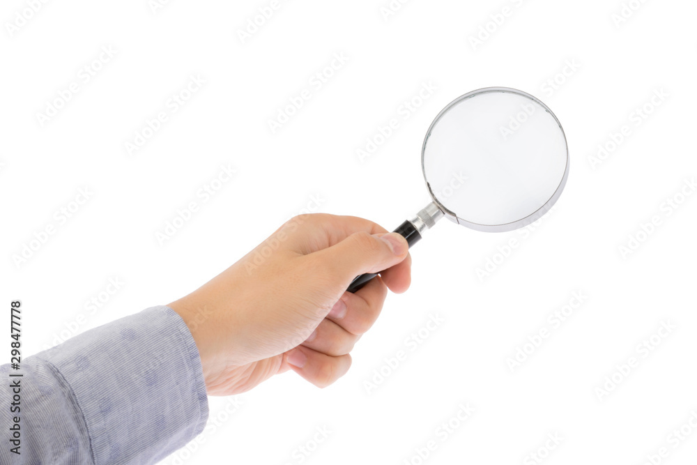 Hand holds magnifying glass isolated on white background Hand holds magnifying glass isolated on white background