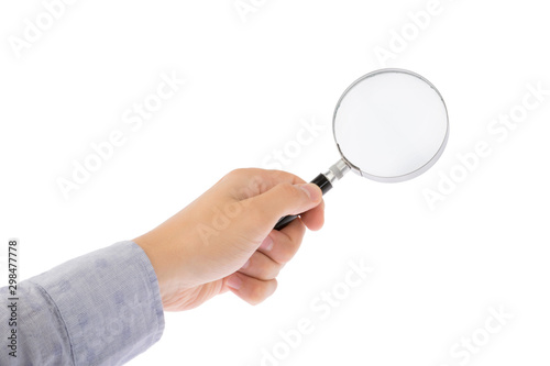Hand holds magnifying glass isolated on white background