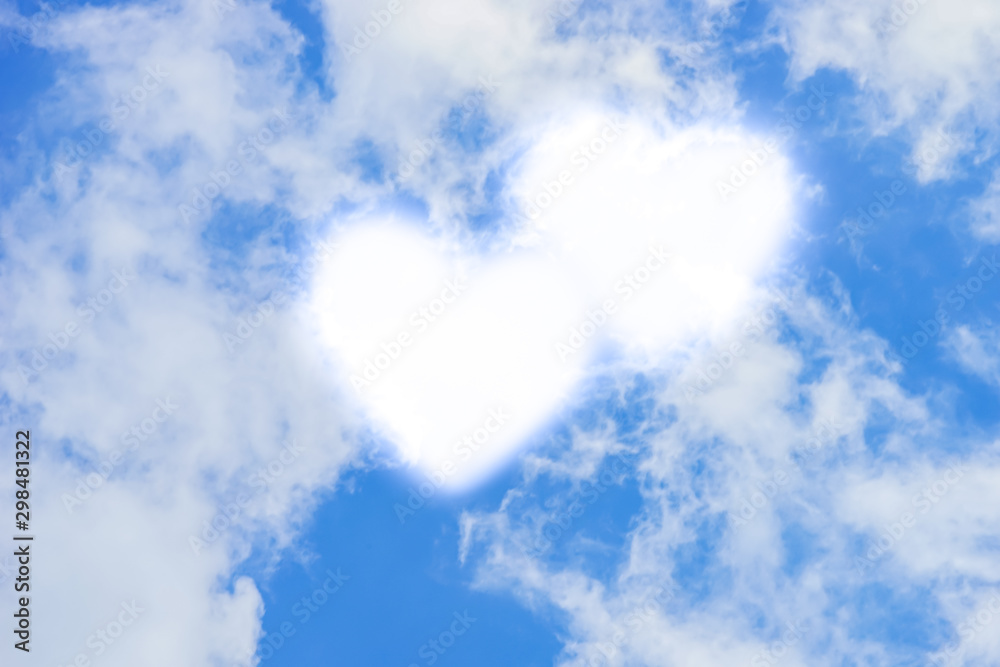 Fototapeta premium Blue sky with white clouds in hearts shape.