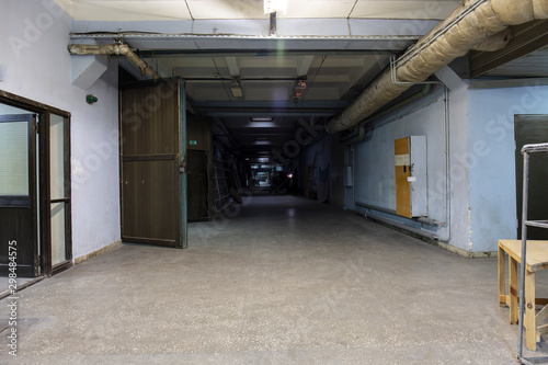 Wallpaper Mural  Long dark corridor in an old industrial building Torontodigital.ca