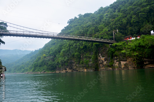 The hanging suspension bridge of Umngot river in Dawki, Shillong, Meghalay near India-Bangladesh border as seen from below the river 