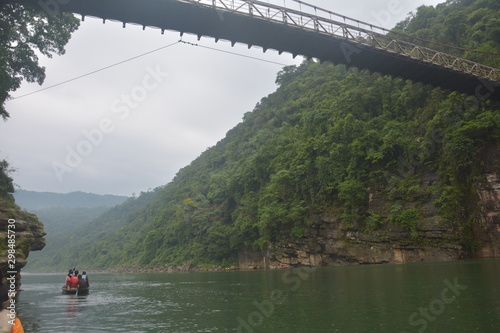 The hanging suspension  bridge of  Umngot river in Dawki, Shillong, Meghalay near India-Bangladesh border as seen from below the river  photo