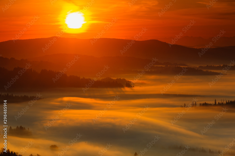 Misty sunrise in mountains