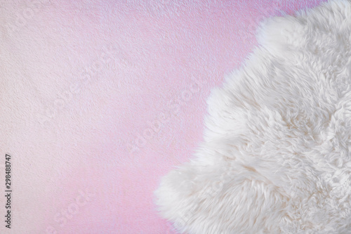Background with white and pink sheep skin, wool texture