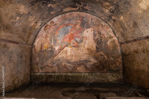 Fresco Representing the Mithras divinity was killing a white bull, inside of the Mithraeum of Ancient Capua. photo