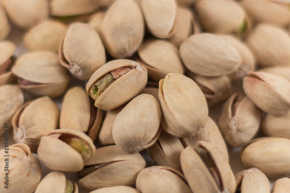 Close Up of a Pile of Organic Pistachios on White Background