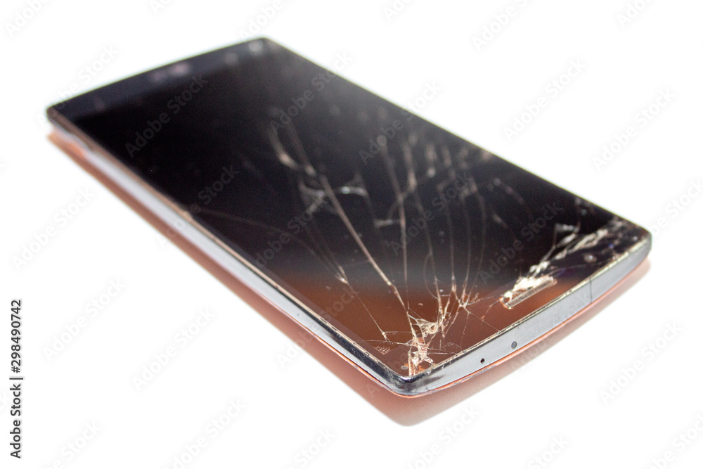 cracks on the smartphone screen. broken smartphone.