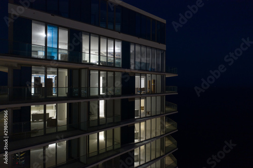 Night photo highrise tower view of interior apartments