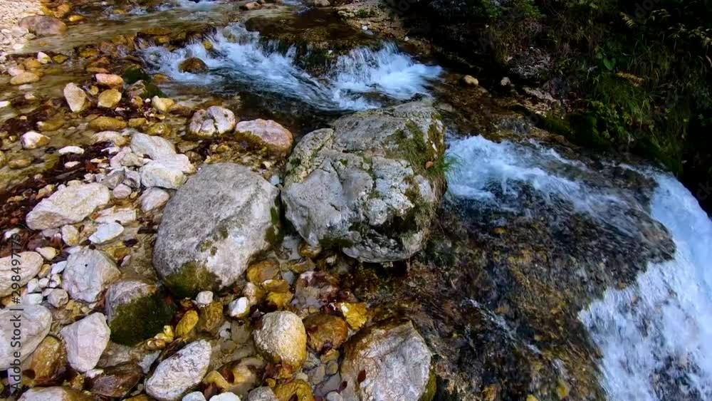 4k backwards view of upper Pericnik waterfall flowing down cliff in pristine untouched nature 4k backwards view of upper Pericnik waterfall flowing down cliff in pristine untouched nature