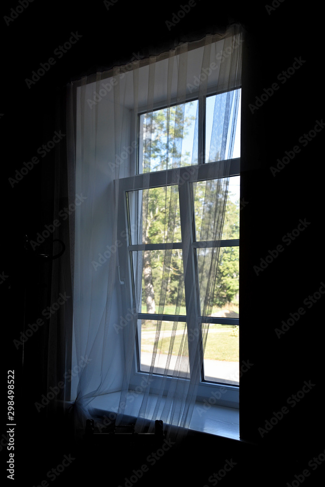 Window with white curtains. Window with white curtains.