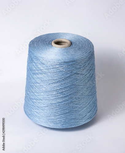 bobbin of yarn on a white background. Side view.Textile reel on isolated white background.