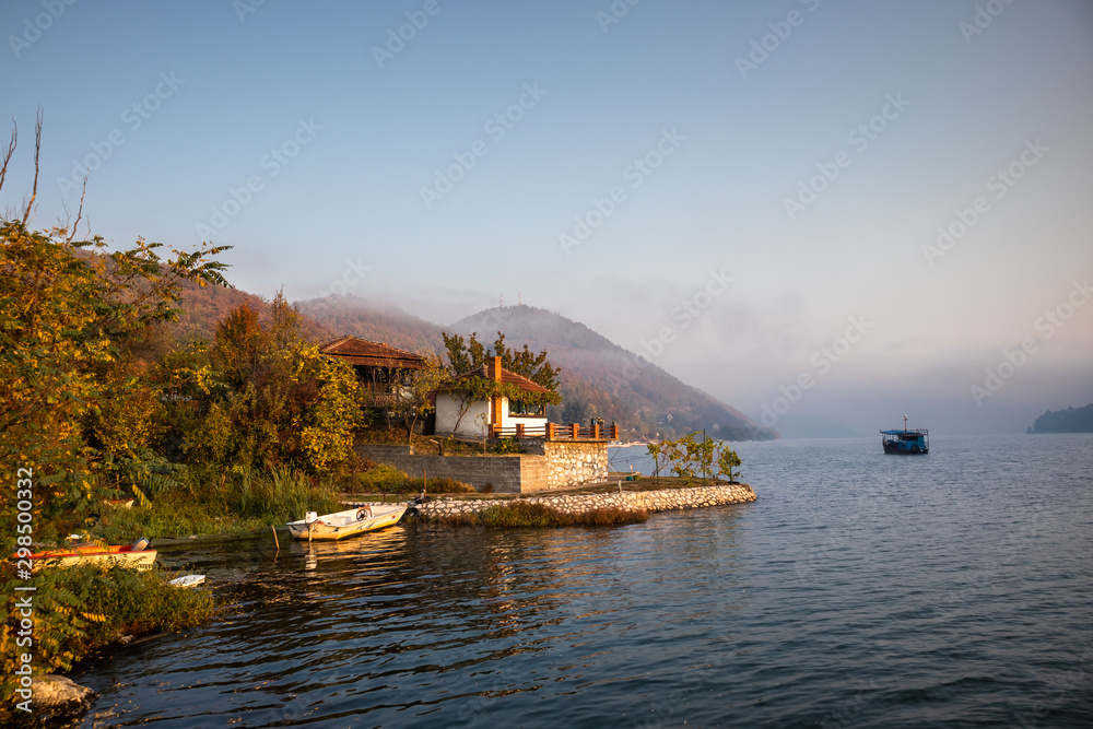 Boats on Danube river at sunrise near the Donji Milanovac in Serbia Boats on Danube river at sunrise near the Donji Milanovac in Serbia